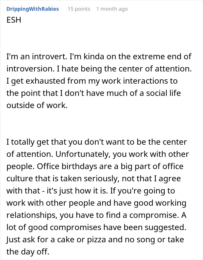 Annoyed worker sitting at desk with birthday cake, showing frustration during office celebration. - 35