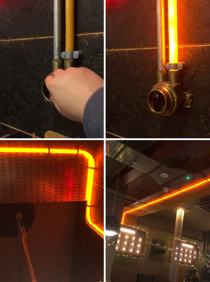 Hand turning switch to activate glowing orange neon light pipes integrated into room design, showcasing small genius country ideas.