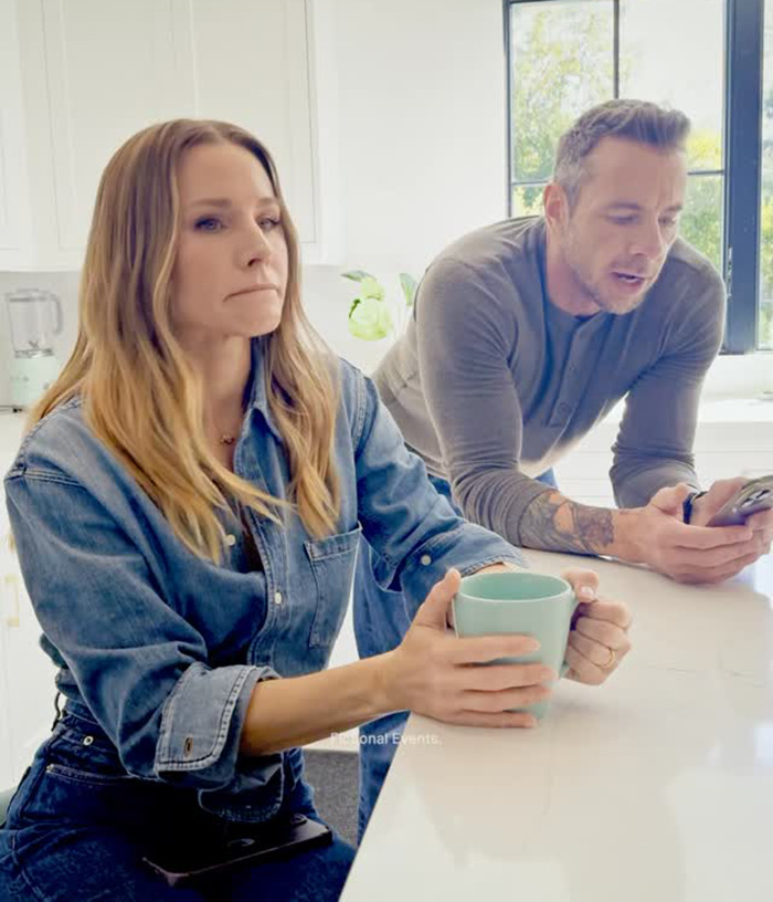 Dax Shepard and Kristen Bell sitting at a kitchen counter with a mug and phone, casual moment captured. - 6