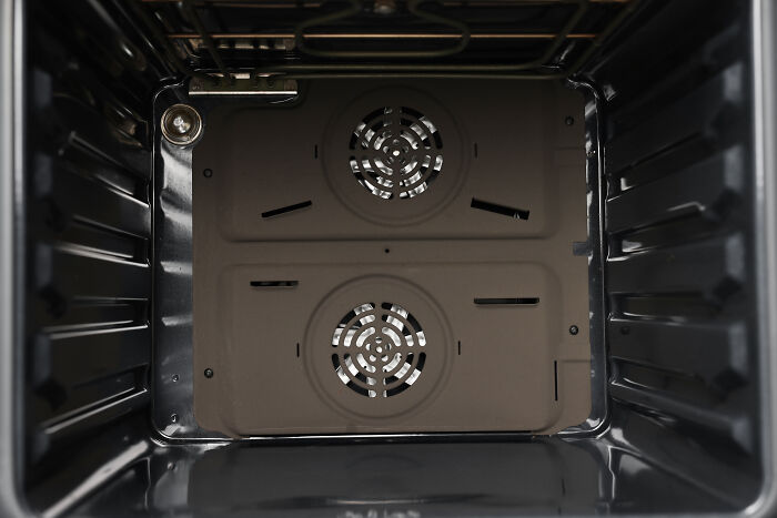 Empty oven interior with fans, illustrating one of the surprisingly silent things deaf people reveal related to noise perception.