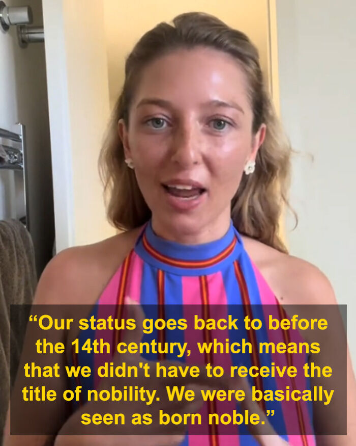 29YO student sharing her heritage as a descendant of the last king of Mongolia in a colorful striped top.