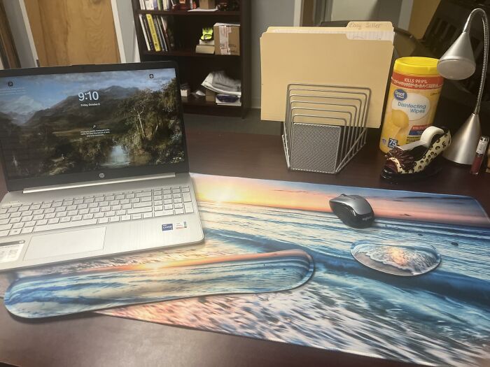 Workspace featuring a large ocean-themed desk mat and wrist rest transforming the workspace into a low-key holiday destination.