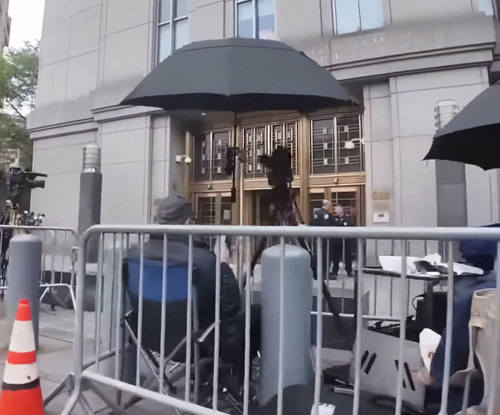 Media crew outside courthouse covering Diddy's trial as judge receives surprise note from jury after hours of deliberation.