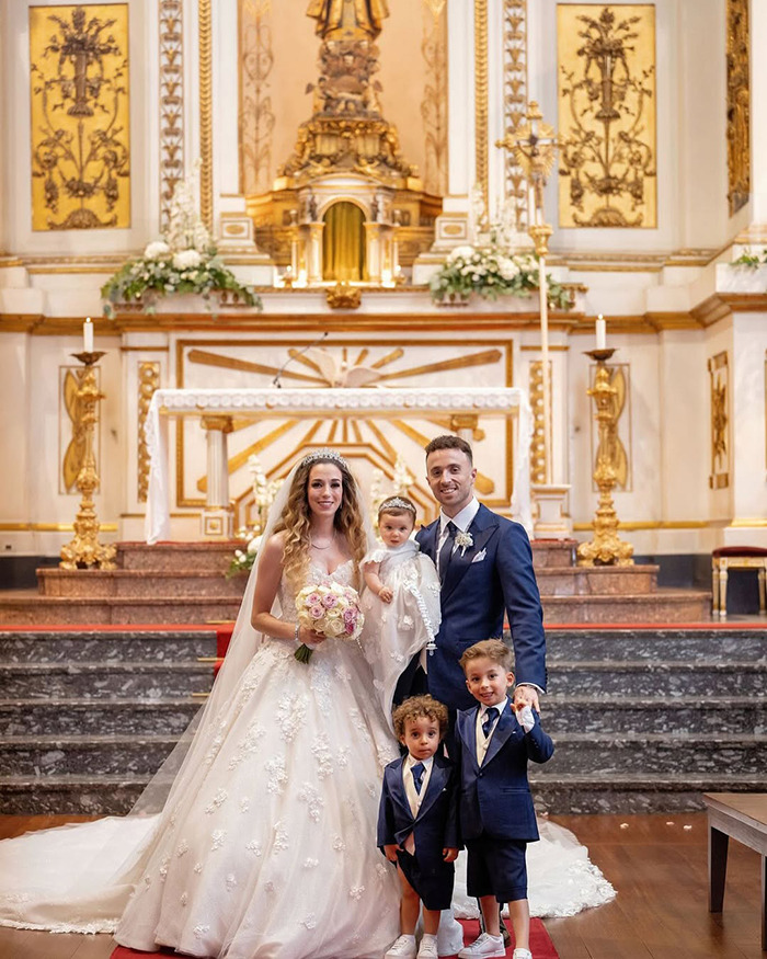 Wedding photo in an ornate church symbolizing reminder of life&rsquo;s fragility and heartbreak over Diogo Jota&rsquo;s final post.