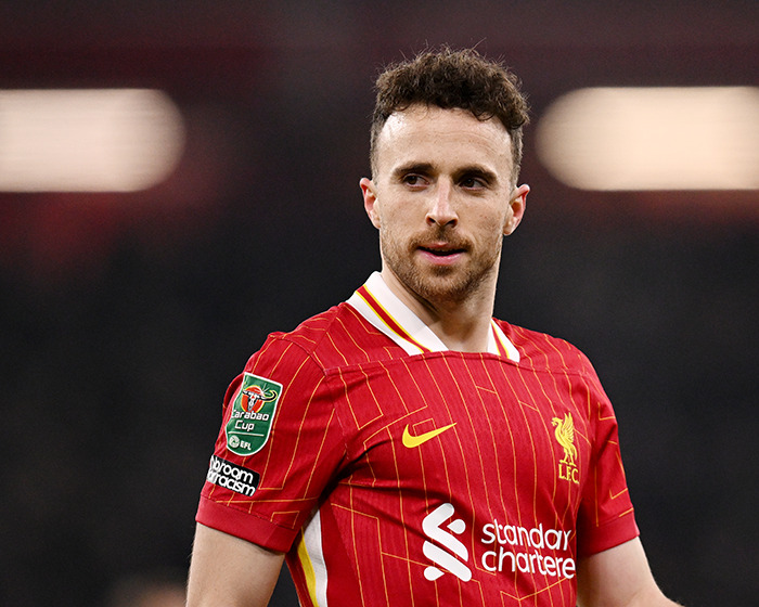 Soccer player Diogo Jota in Liverpool kit on the field, highlighting the reminder of life's fragility and heartbreak.