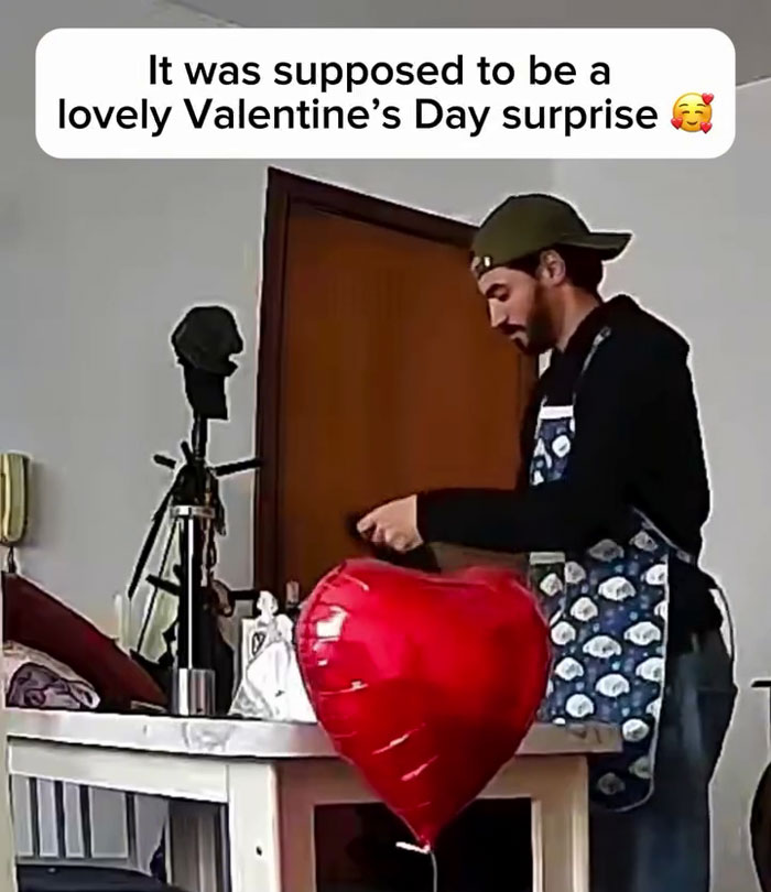 Man preparing romantic plans with heart-shaped balloon and Valentine’s Day surprise in a living room setting. Man preparing romantic plans with heart-shaped balloon and Valentine’s Day surprise in a living room setting.