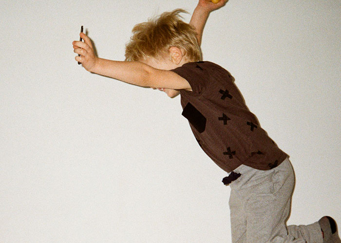 Young child in midair, arms raised, illustrating one of the dumbest reasons that almost cost people their lives.