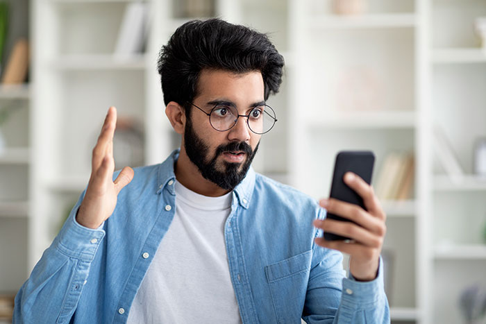 Man with glasses reacting dramatically during a video call, illustrating dramatic deathbed confessions concept. - 6