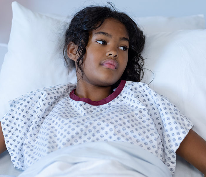 Young woman in hospital bed appearing thoughtful and reflective during a dramatic deathbed confession moment - 16