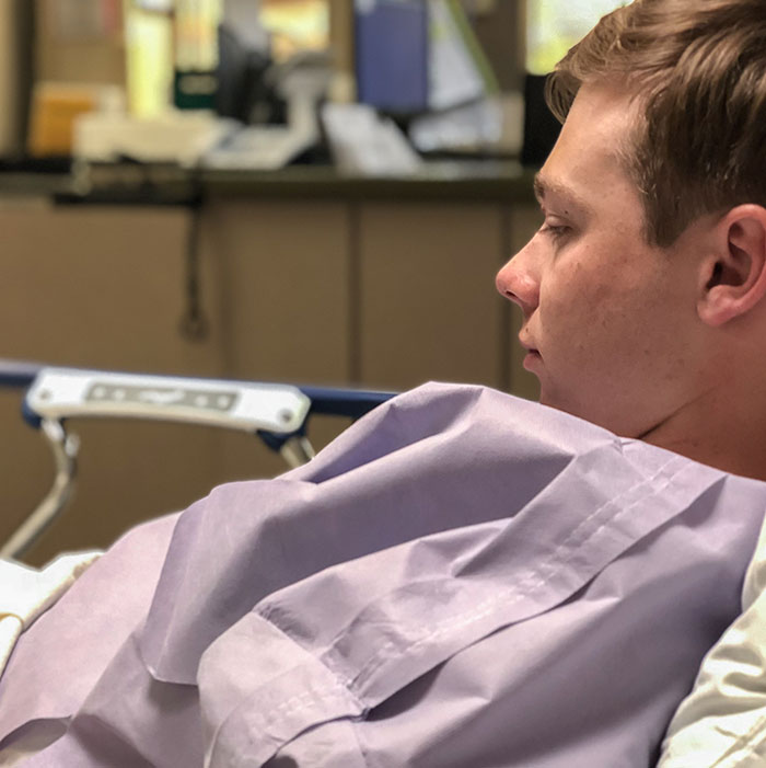 Young man lying in a hospital bed making dramatic deathbed confessions but not actually dying. - 5