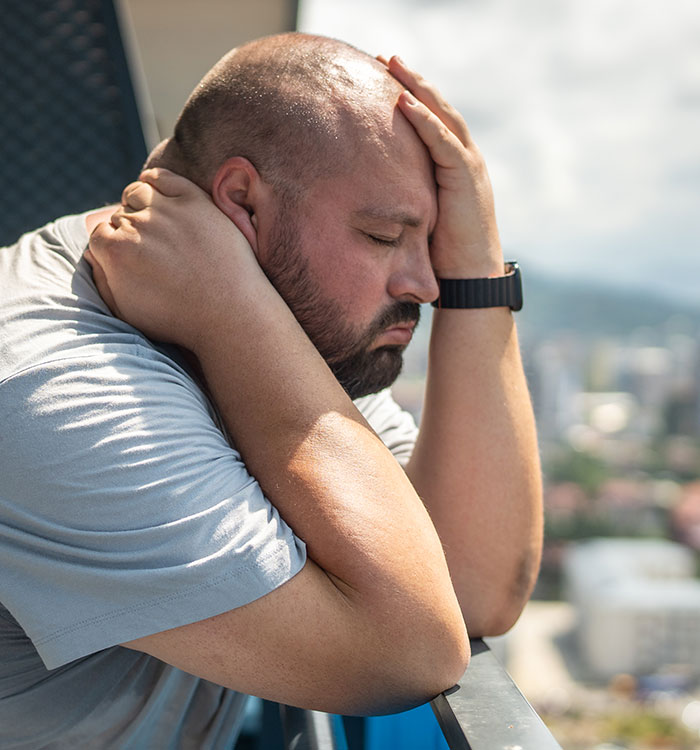 A man holding his head in distress, reflecting on dramatic deathbed confessions that didn't lead to death. - 17
