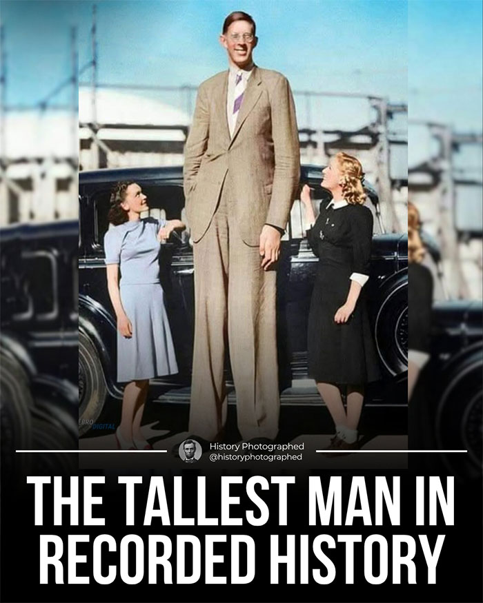 Tallest man in recorded history standing next to two women illustrating easiest world records to break.