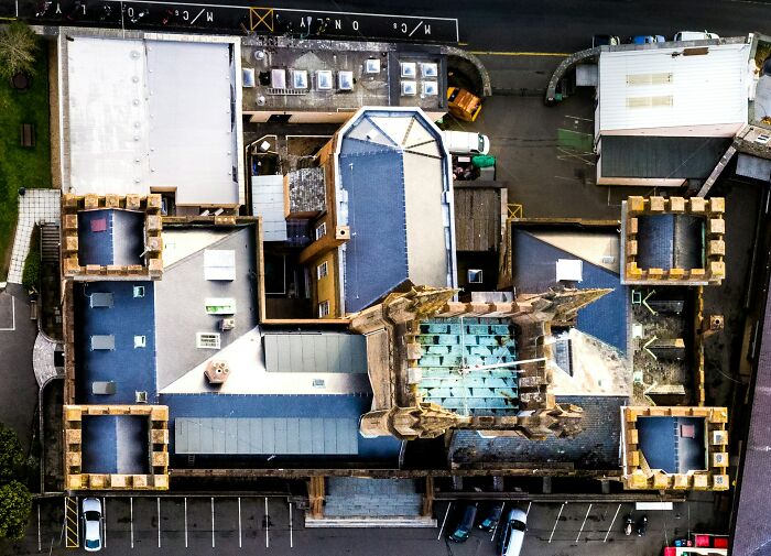 Aerial view of an old building with a collapsing roof symbolizing structures on the brink of collapse. - 26