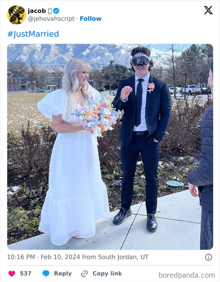 Bride in white dress holding flowers and groom in suit wearing goggles, showcasing grooms sense of entitlement outdoors.
