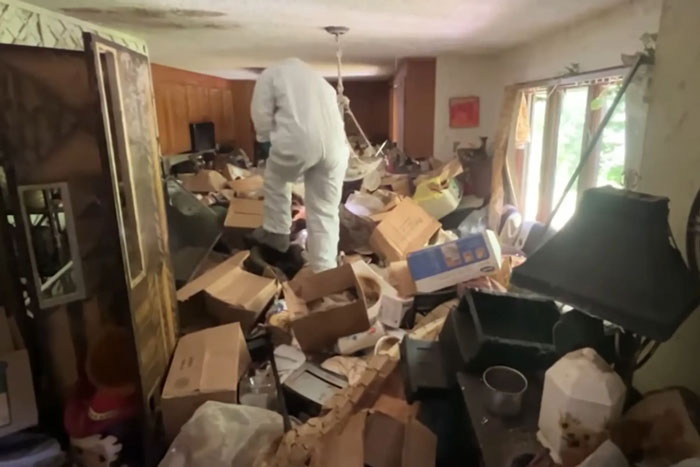 Police investigating skeletal remains found buried under trash in hoarder ex-cop's cluttered house of horrors.