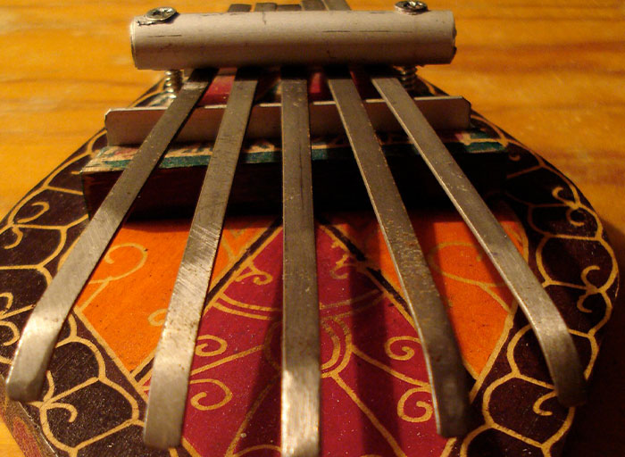 Close-up of a personal and thoughtful gift, a handcrafted musical instrument with metal keys and colorful design.