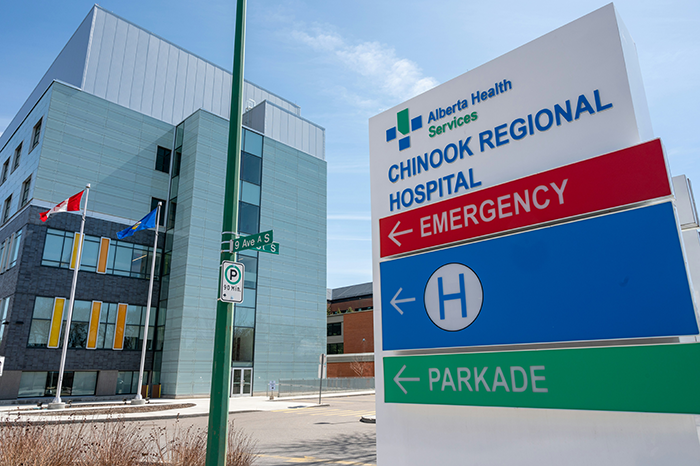 Hospital exterior with emergency and parking signs, relevant to family blacklisted local babysitters concerns nearby.