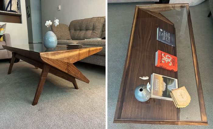 Modern wooden coffee table with glass top in a living room, showcasing people experiencing unbelievable luck moments.