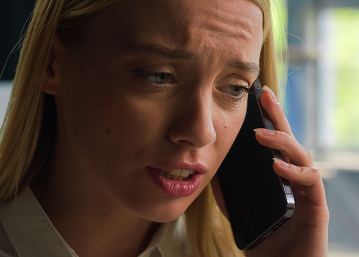 Close-up of a worried pregnant woman on phone showing emotions after a friend’s guest steals from her home. - 33