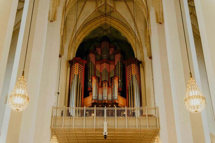 Pipe organ in a large church interior where a guy agrees to perform at friends wedding and sues after no payment - 19