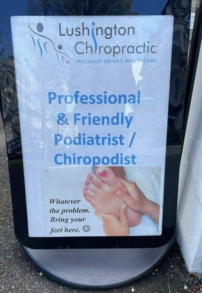 Sign for a podiatrist with a photo of hand holding a foot, illustrating another unattainable body portrayed in advertising fails.