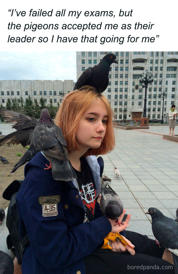 Young woman surrounded by pigeons, humorously captioned about being accepted as their leader in funny animal memes.