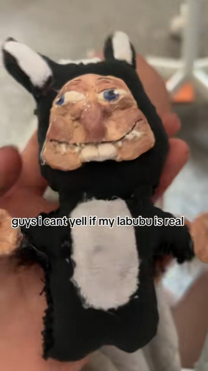 Hand holding a creepy fake Labubus doll with distorted face and fabric body, illustrating nightmare-inducing Labubus fakes.