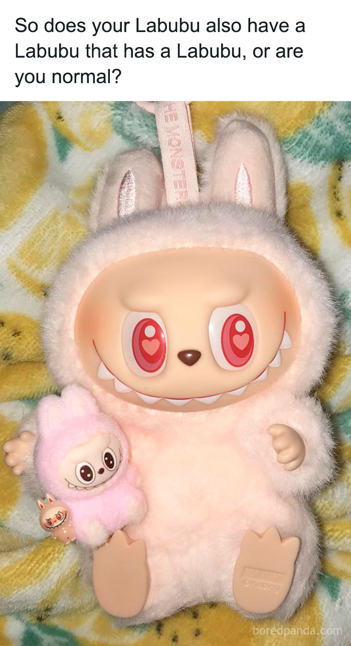 Labubu doll holding smaller Labubu dolls, showcasing the unique and playful design of the Labubu doll collection.