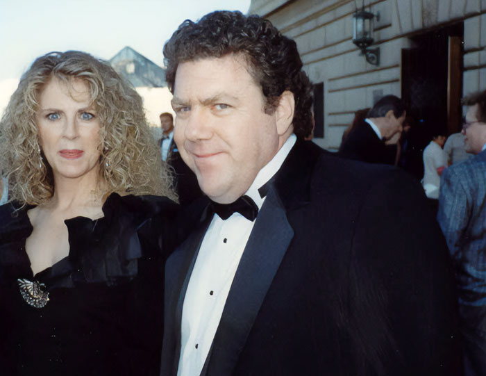 Two stars dressed in formal attire at an outdoor event, representing stars we've lost this year in July.