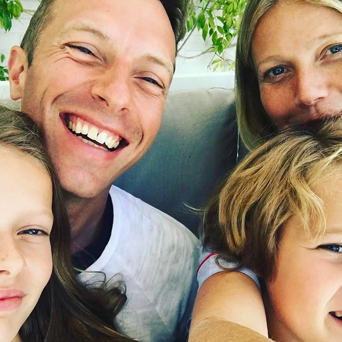 A close-up of a smiling family on vacation, unrelated to Gwyneth Paltrow ending friendship with Madonna. - 6
