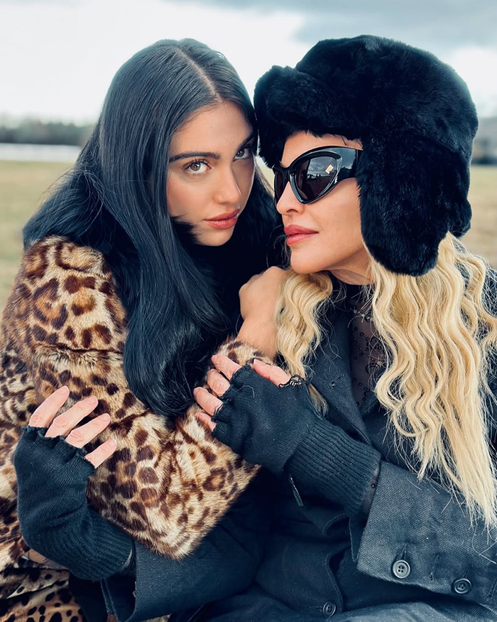 Two women dressed in winter attire share an intimate moment referencing Gwyneth Paltrow and Madonna friendship ending. - 7