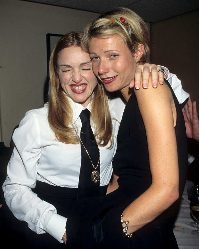 Gwyneth Paltrow and Madonna smiling together at an event before their friendship ended over a vacation incident. - 11