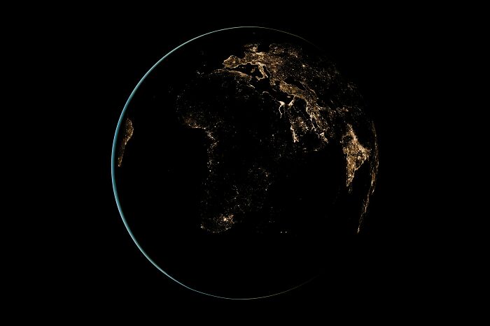 Earth at night showing illuminated cities, illustrating bizarre beliefs about the world despite science myth busting. - 3