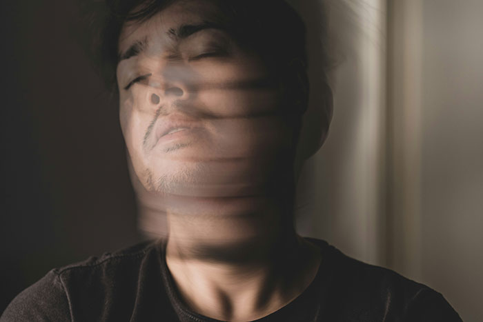 Man with blurred face movement illustrating hospital staff sharing wildest things they've witnessed in healthcare.