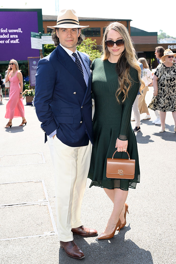 Couple dressed in stylish Wimbledon 2025 celebrity looks, featuring elegant summer outfits and accessories at the event.
