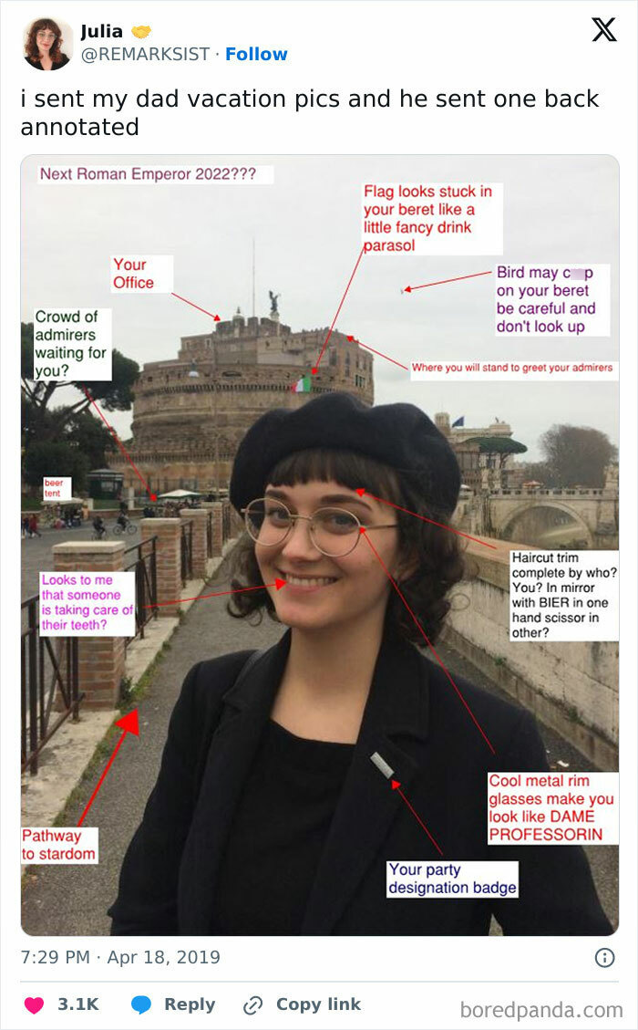 Woman with glasses and beret standing by a river with humorous annotated vacation photo, showing hilarious dad moments.