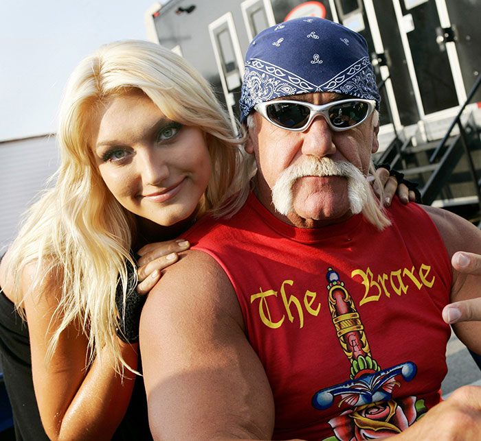 Hulk Hogan at a press event with a woman, sharing details about the pro wrestler&rsquo;s final moments and 911 call.