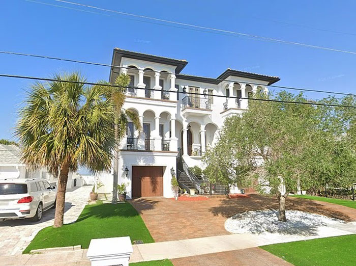 Large white Mediterranean-style house with a palm tree in front, related to Hulk Hogan's press conference on pro wrestler's final moments.