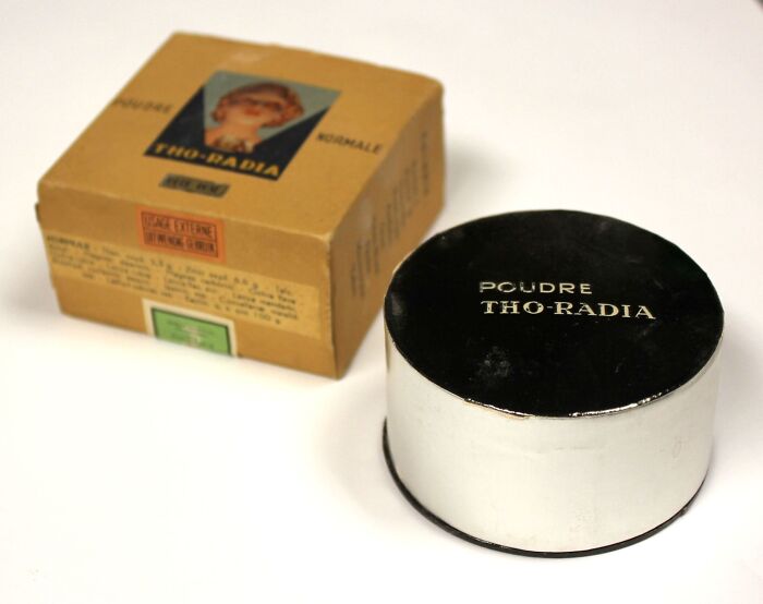 Vintage beauty gadget powder container with original box, an example of 1920s-1940s beauty gadgets resembling t*****e devices.