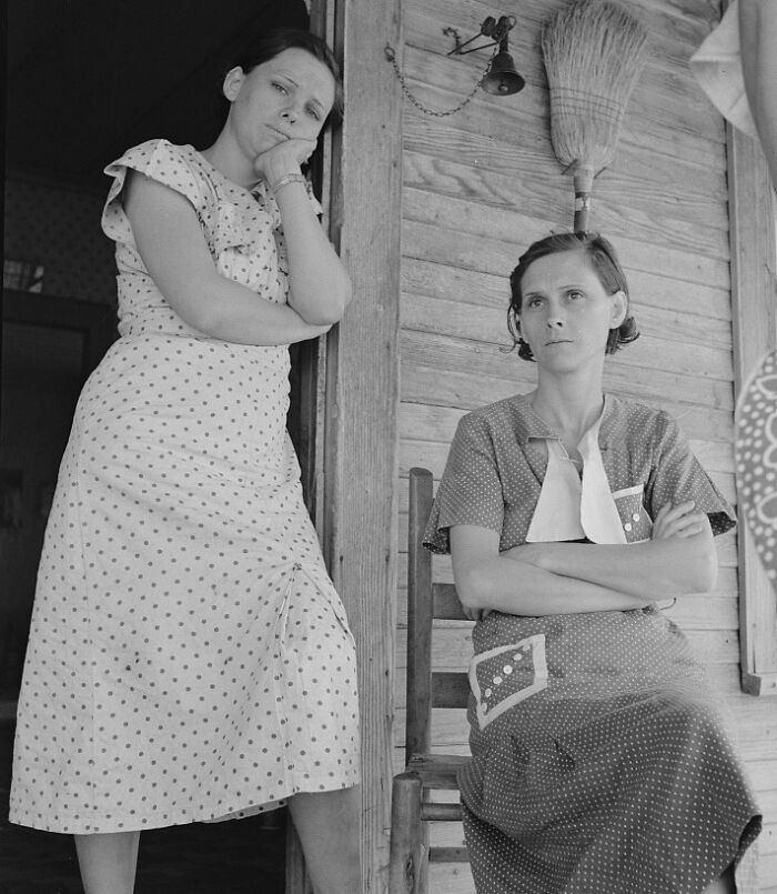 Two women in polka dot dresses showing the hardship of the Great Depression era in a rare historic photo.