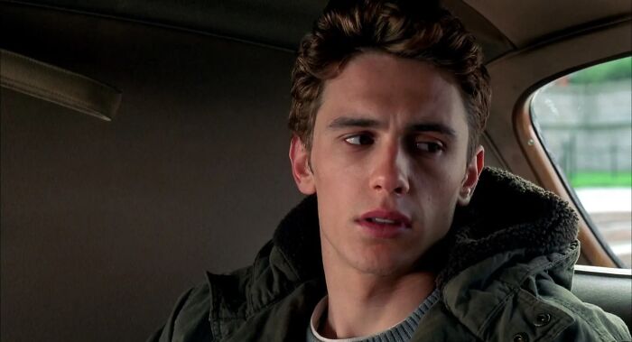 Young actor sitting in a car, portraying a character from 16 actors who auditioned for Heroes but became iconic villains.