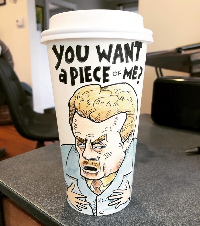 Coffee cup with a humorous cartoon character and bold text showcasing relatable coffee cup art by the artist.