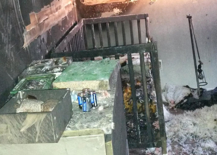 Dimly lit abandoned room with decayed furniture and scattered items, evoking creepy true stories that haunt people.