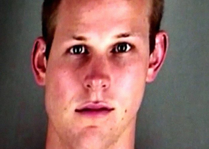 Close-up of a young man with a serious expression, illustrating creepy true stories that haunt people.