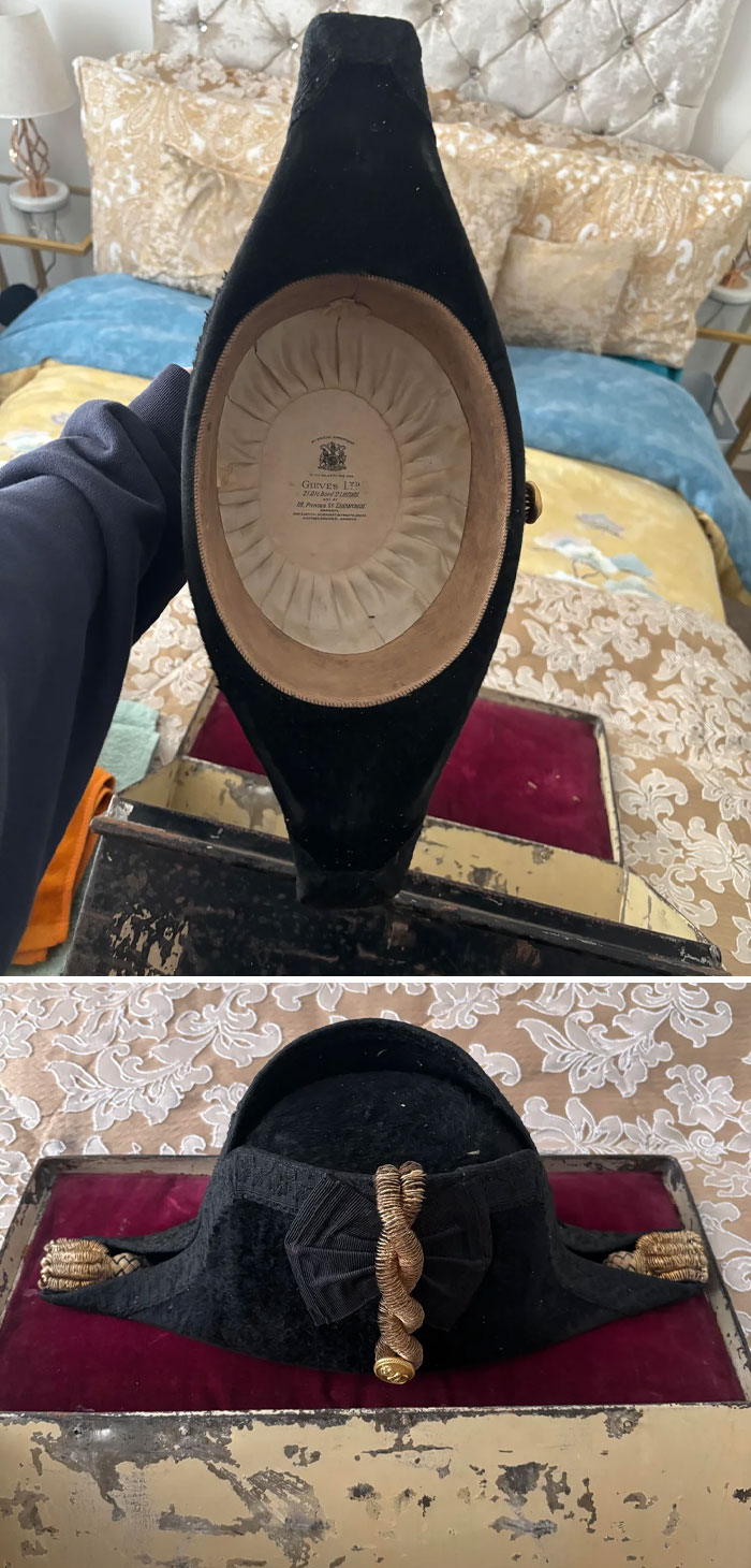 Antique black military hat with gold trim and insignia, one of the most interesting and beautiful old things owned.