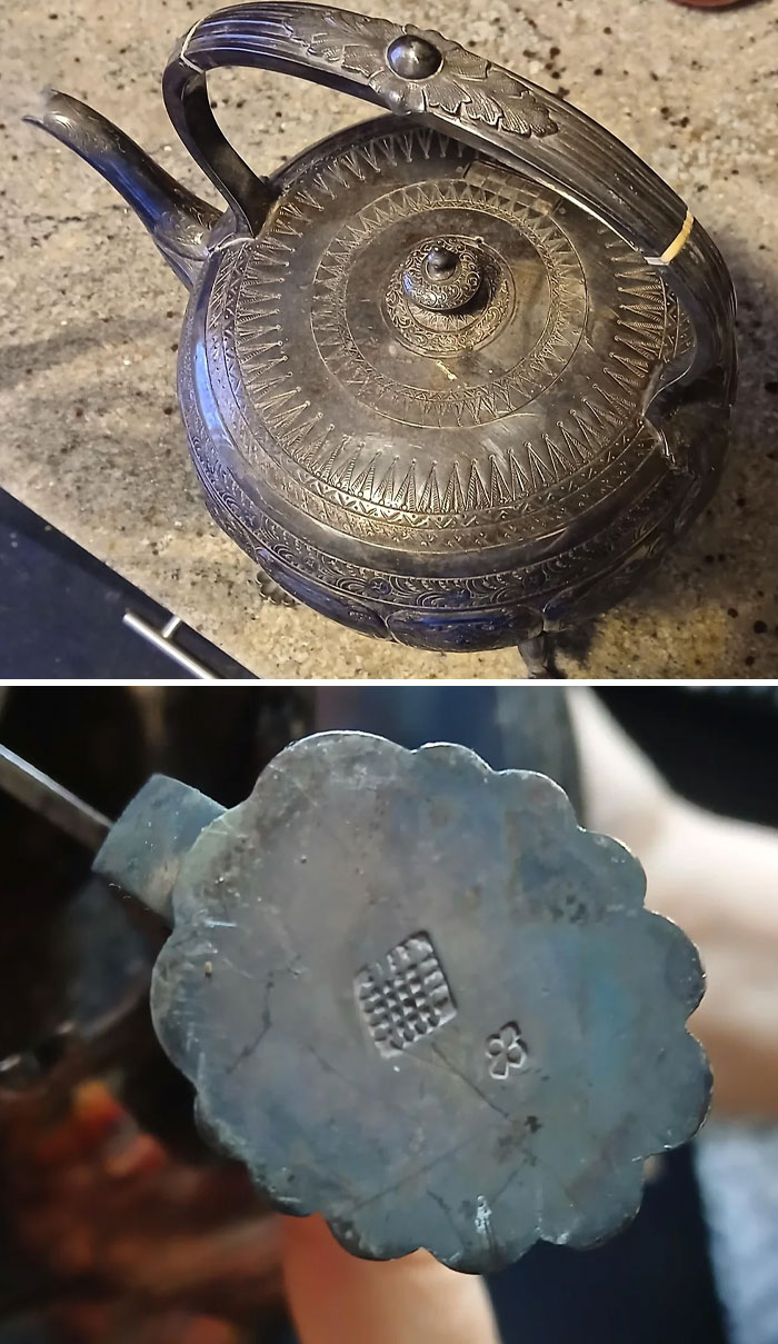Antique intricately designed metal teapot with detailed engravings and unique maker’s marks on the base.