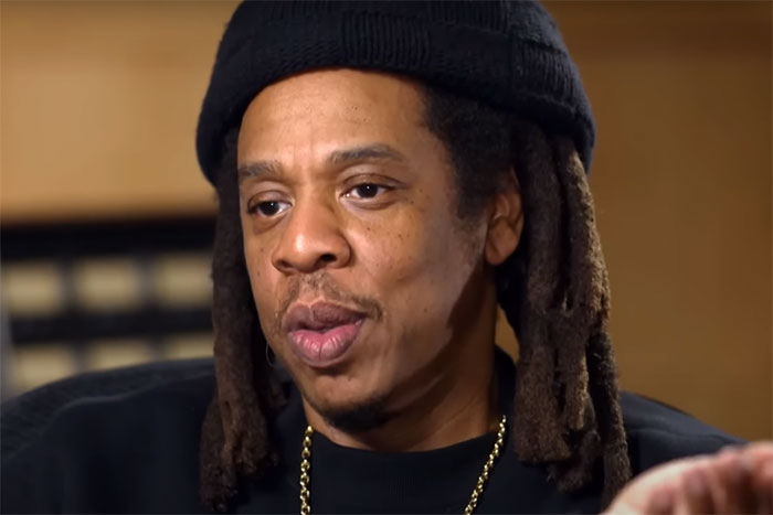 Close-up of a man with dreadlocks and a black beanie sharing his most awkward and favorite encounters with celebrities. - 21