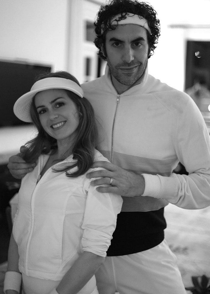Isla Fisher and Sacha Baron Cohen posing together in sporty outfits before their divorce and marriage update. - 9