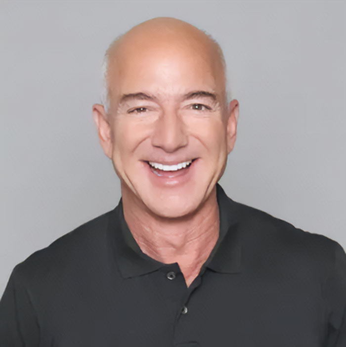 Jeff Bezos smiling in a black polo shirt, surprising fans with a new look after ditching his bald style.