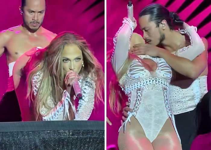Jennifer Lopez performing on stage with dancers, wearing a white outfit, in a raunchy show criticized as cheap.